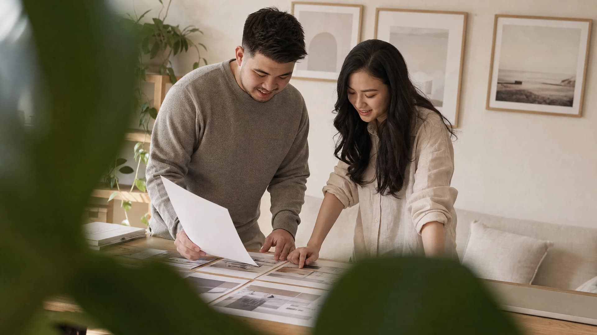 Joshua and Sharon reviewing printed page layouts together
